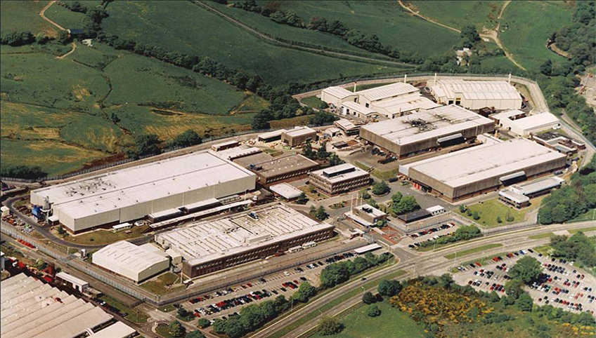 A birds eye view of The Royal Mint facility in Llantrisant with factory surrounded by countryside.